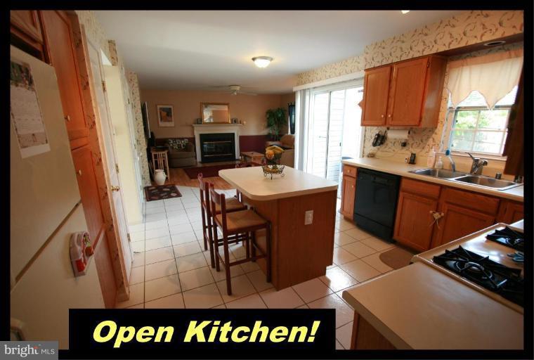 726 Monarch Ridge Road Frederick, MD 21703 - Photo 9 of 12 a kitchen with stainless steel appliances granite countertop a sink and cabinets