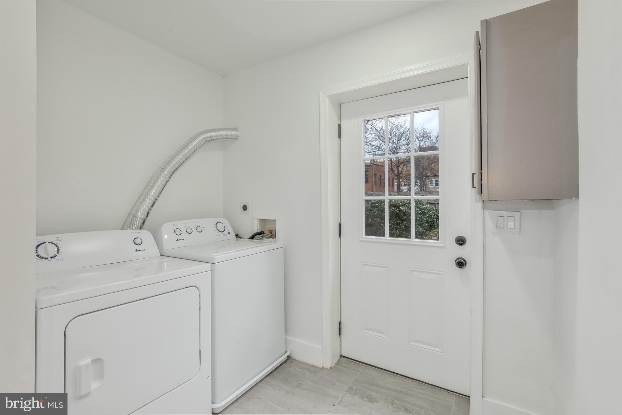 745 Kenyon Street Northwest Washington, DC 20010 - Photo 21 of 27 a utility room with dryer and washer