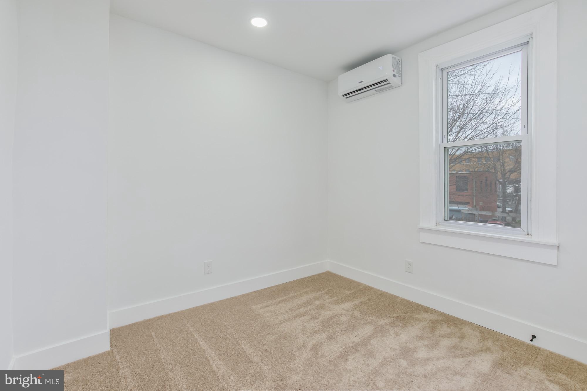 745 Kenyon Street Northwest Washington, DC 20010 - Photo 23 of 27 an empty room with a window