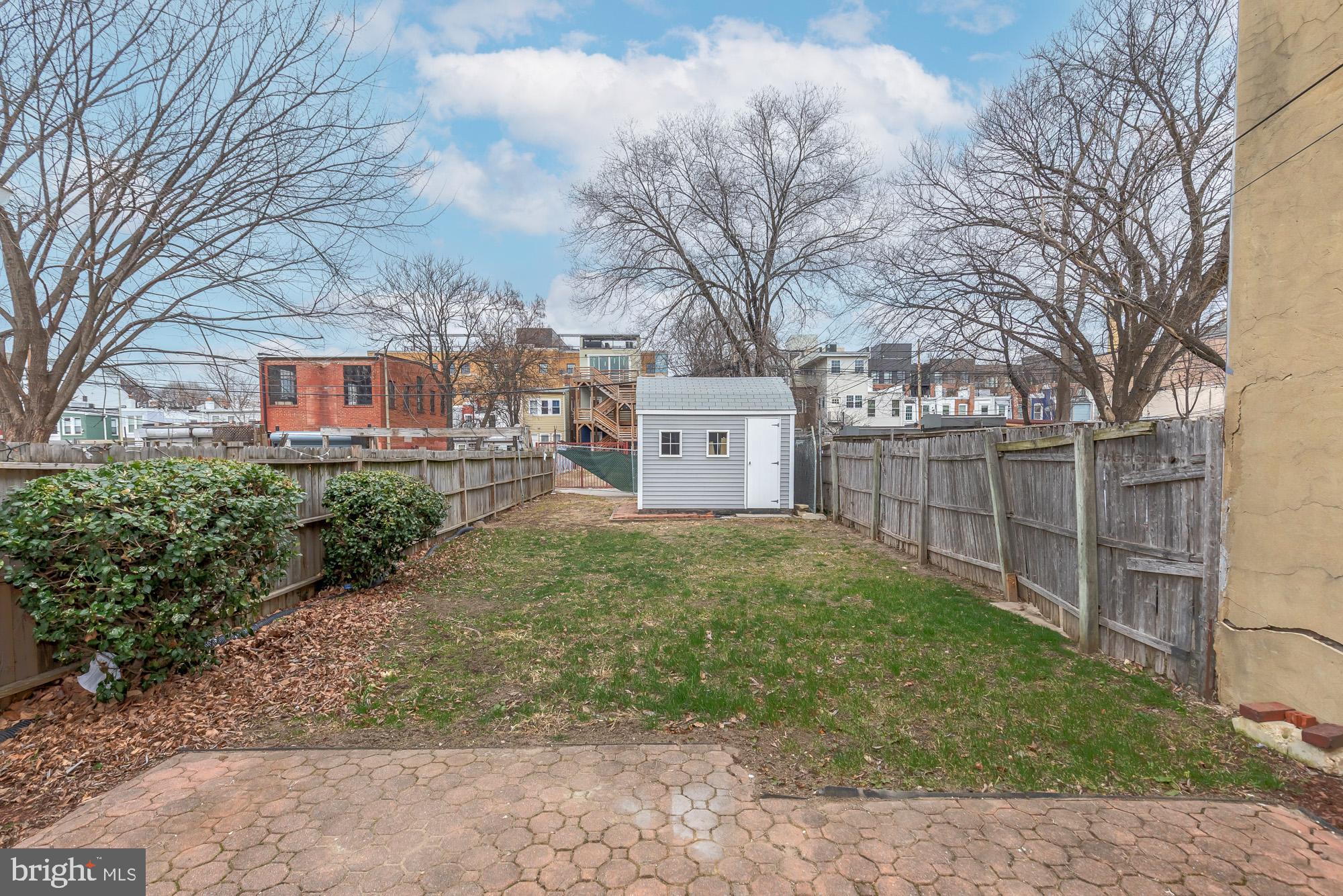 745 Kenyon Street Northwest Washington, DC 20010 - Photo 26 of 27 a view of a house with a yard