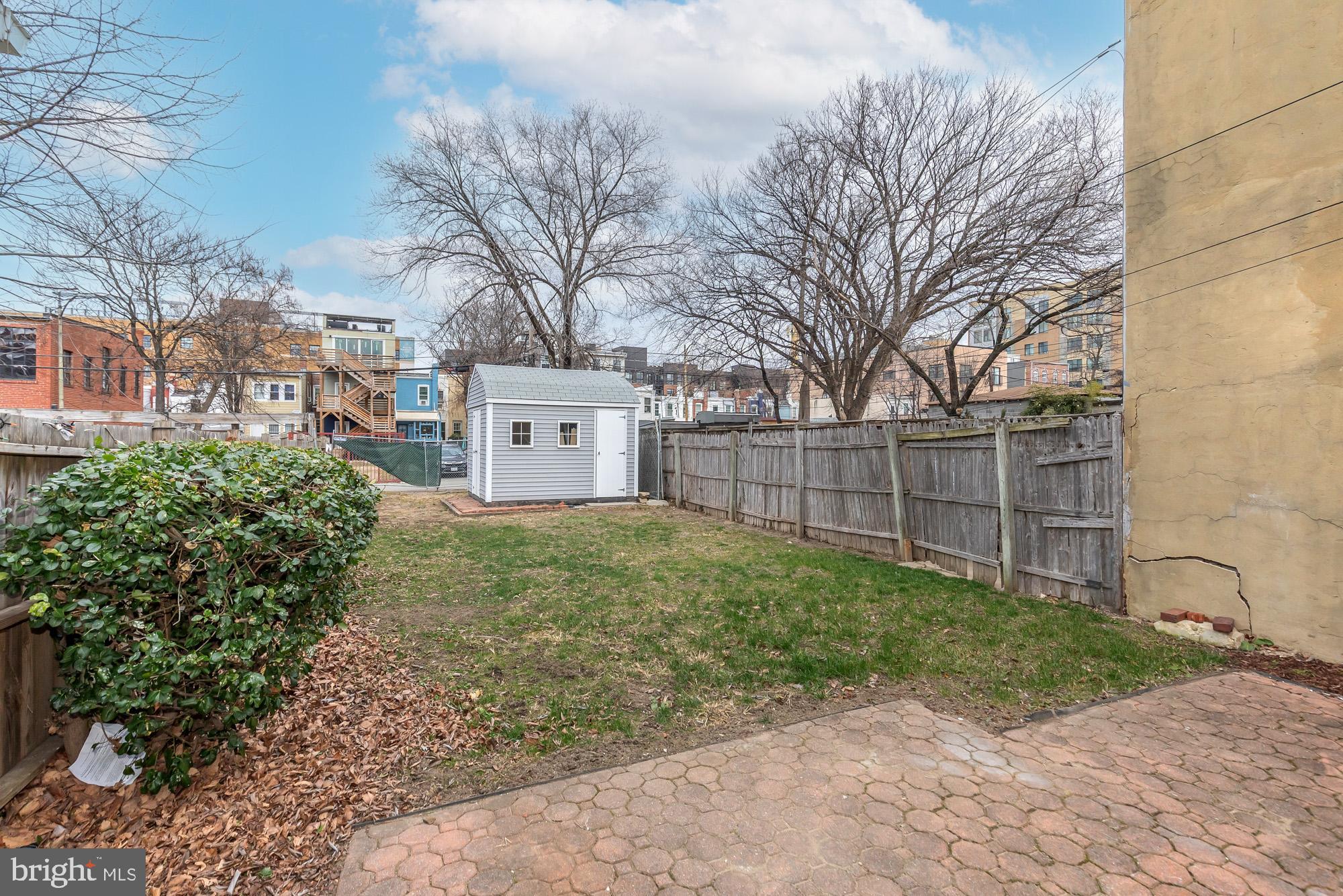 745 Kenyon Street Northwest Washington, DC 20010 - Photo 27 of 27 a view of a yard with a house