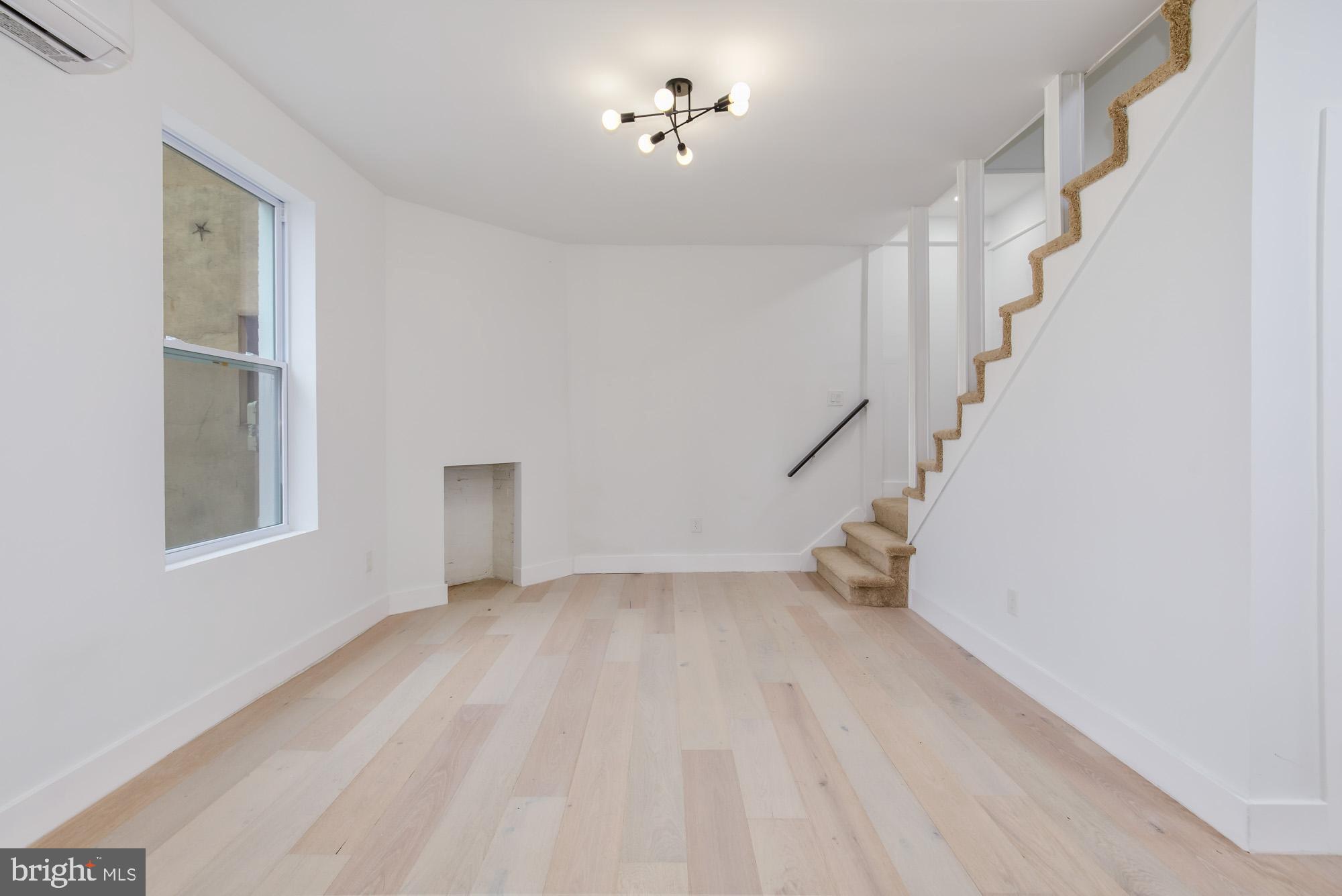 745 Kenyon Street Northwest Washington, DC 20010 - Photo 3 of 27 a view of an empty room with a window