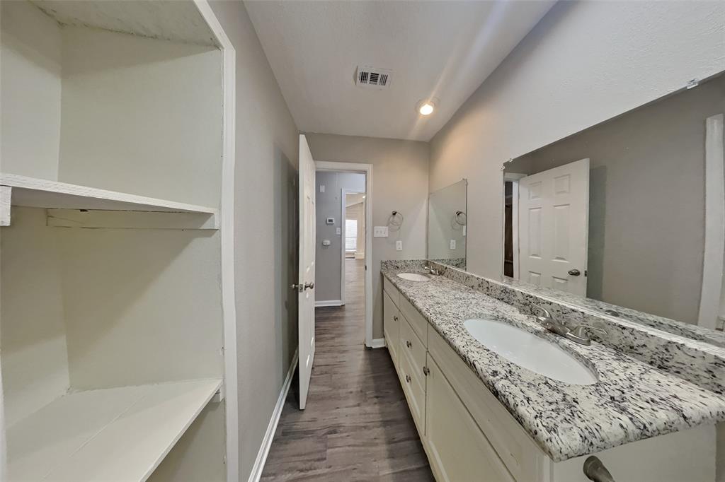 3817 Rochelle Drive Arlington, TX 76016 - Photo 17 of 25 a bathroom with a granite countertop sink and a mirror