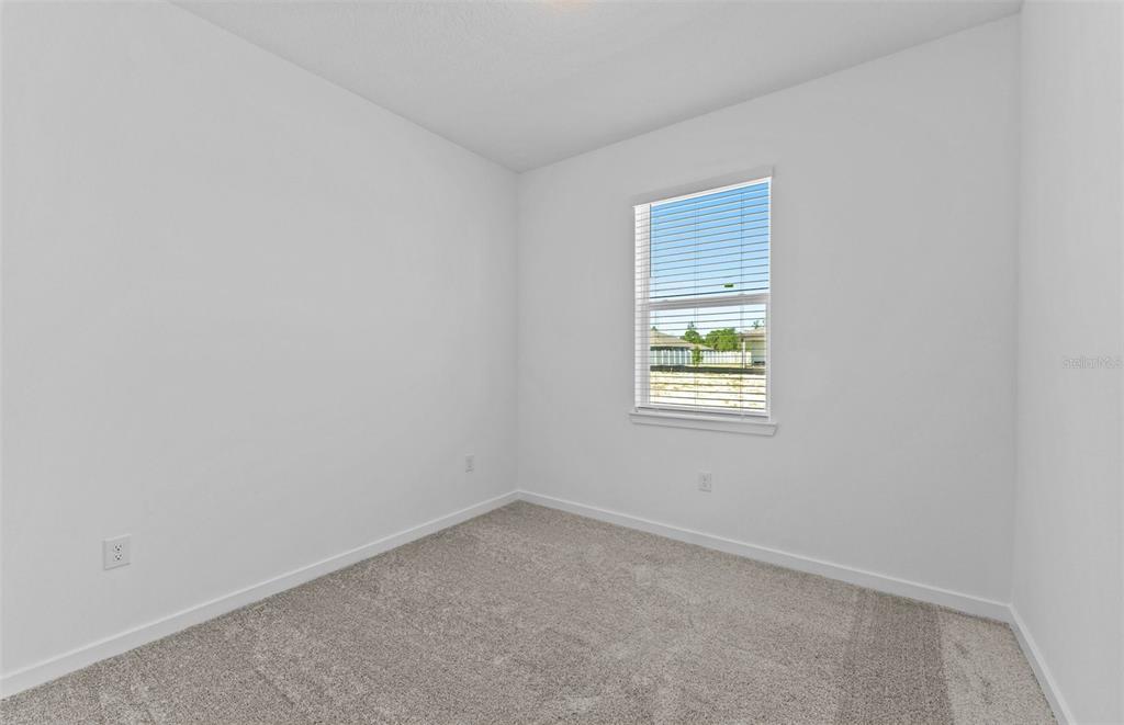 4147 Feldspar Lane Spring Hill, FL 34609 - Photo 13 of 22 an empty room with a window