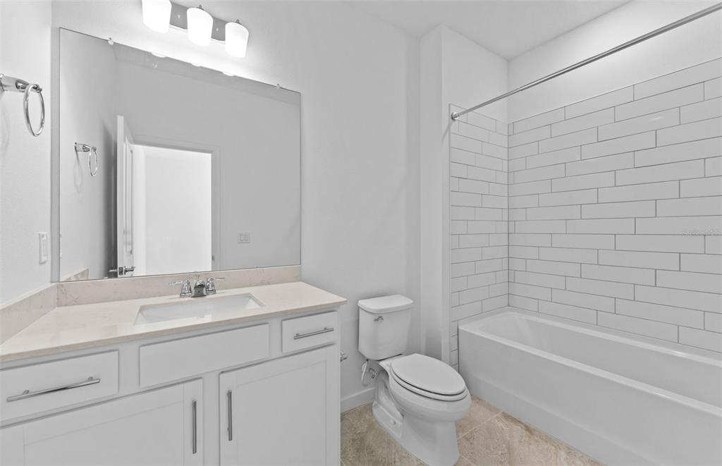 4147 Feldspar Lane Spring Hill, FL 34609 - Photo 15 of 22 a bathroom with a sink a toilet and a bathtub