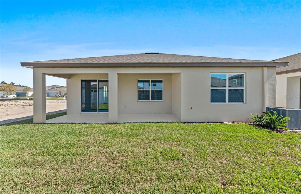 4147 Feldspar Lane Spring Hill, FL 34609 - Photo 17 of 22 a view of front door and yard