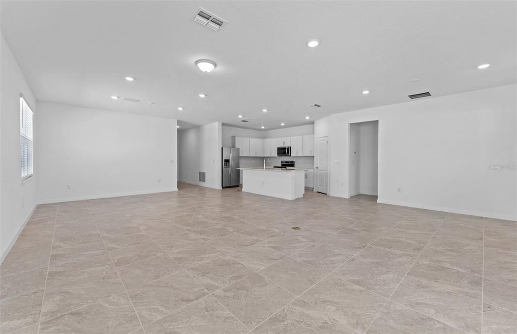 4147 Feldspar Lane Spring Hill, FL 34609 - Photo 6 of 22 a view of empty room with kitchen