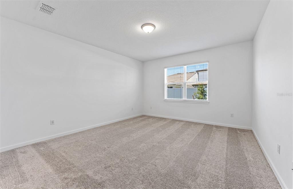 4147 Feldspar Lane Spring Hill, FL 34609 - Photo 8 of 22 an empty room with a window
