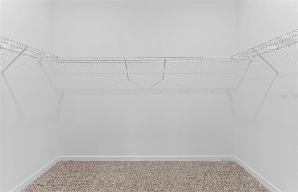 4147 Feldspar Lane Spring Hill, FL 34609 - Photo 10 of 22 a view of a room with racks on the wall