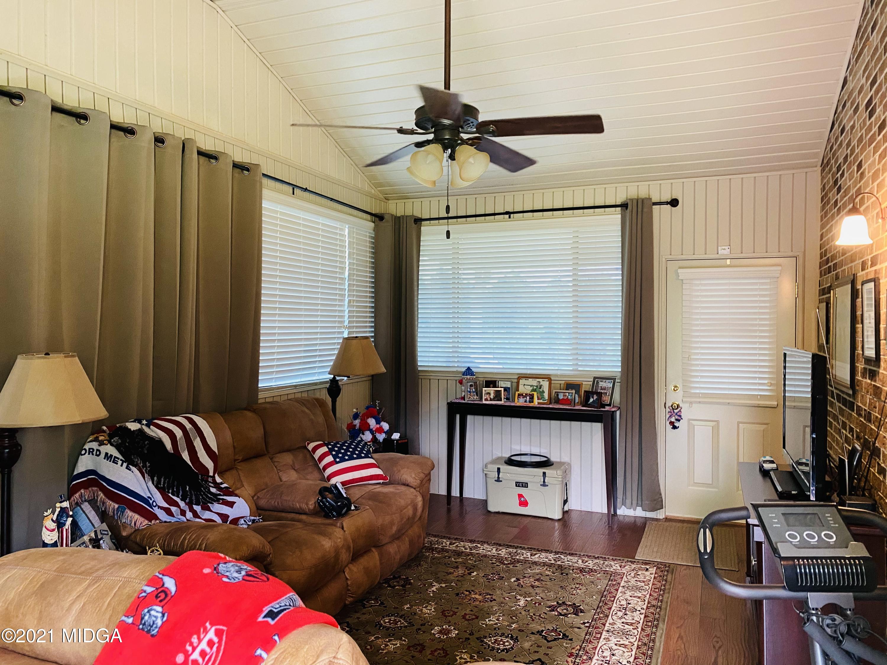 448 Huckabee Road Gray, GA 31032 - Photo 11 of 13 a living room with furniture a window and a flat screen tv