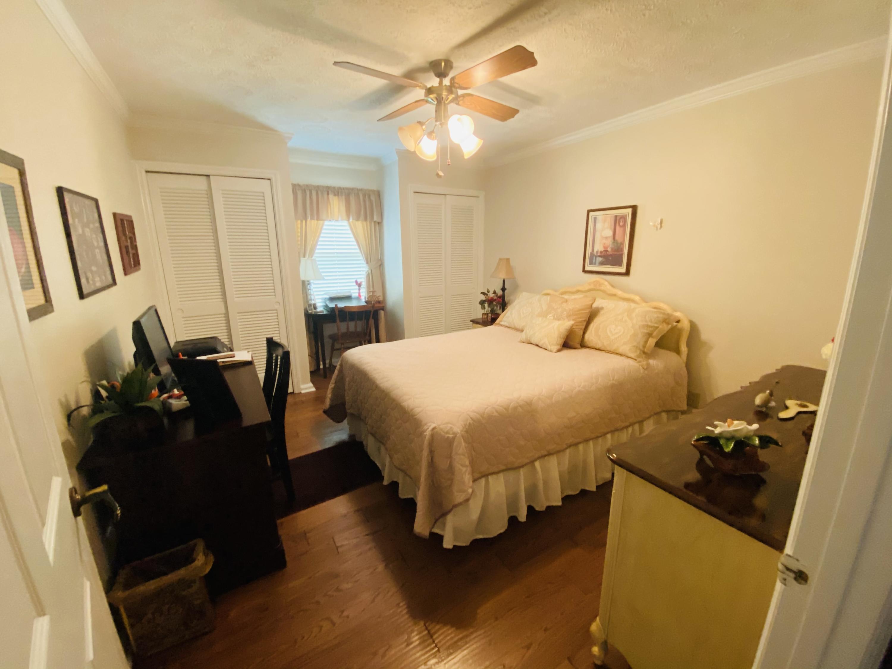 448 Huckabee Road Gray, GA 31032 - Photo 5 of 13 a bedroom with a bed and lamp on the dresser