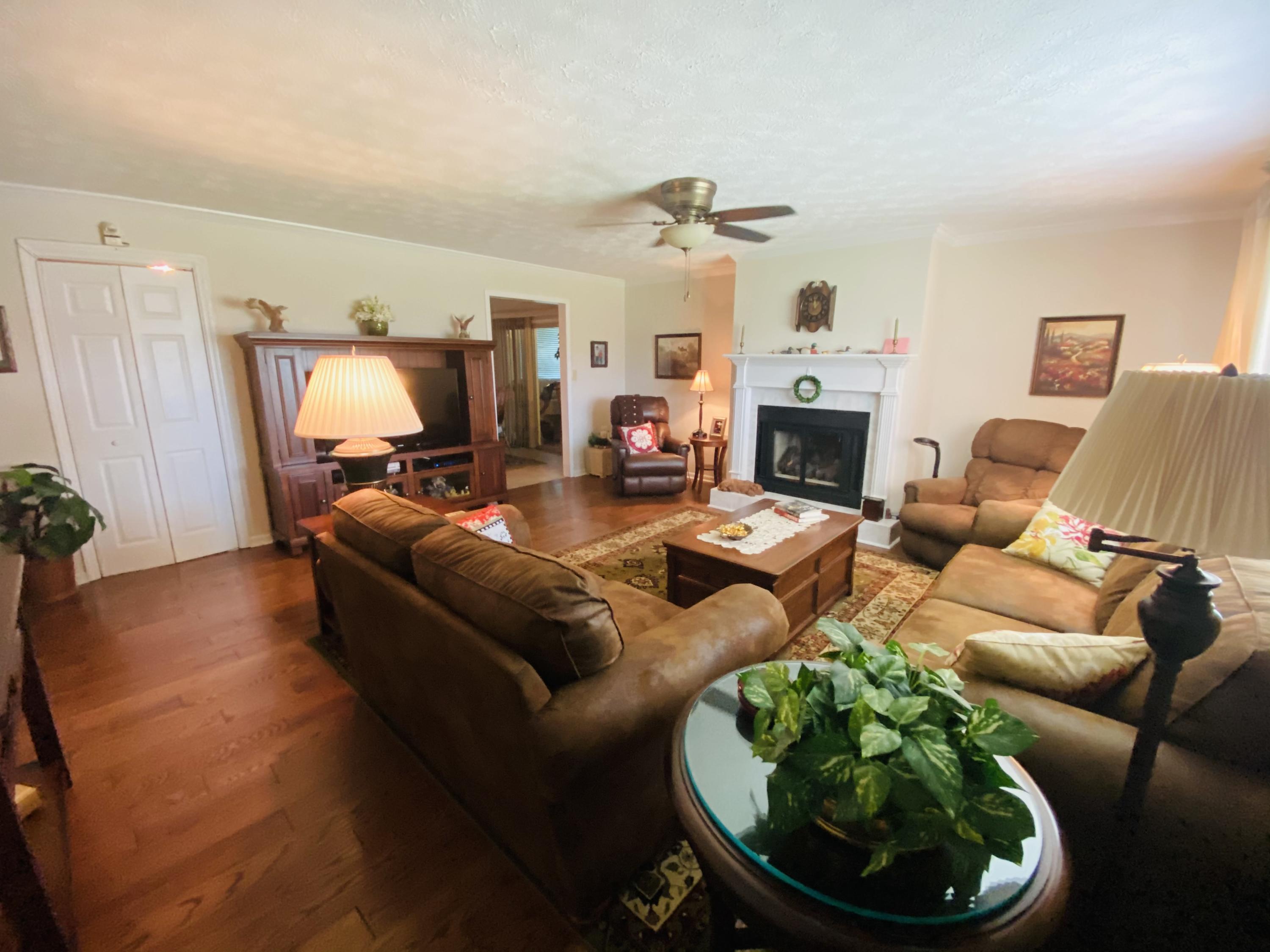 448 Huckabee Road Gray, GA 31032 - Photo 6 of 13 a living room with furniture and a fireplace