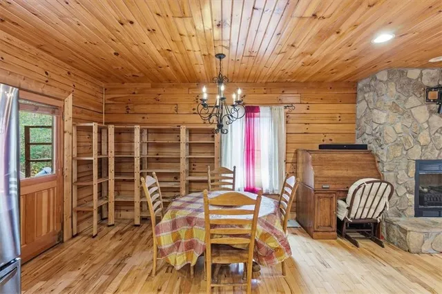 a view of a dining room with furniture and chandelier