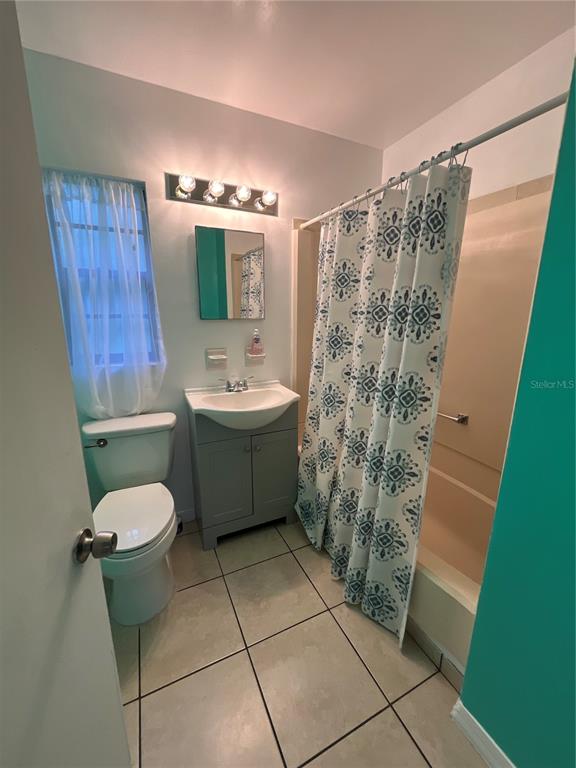 2708 Dixie Road Lakeland, FL 33801 - Photo 15 of 31 a bathroom with a sink toilet and shower