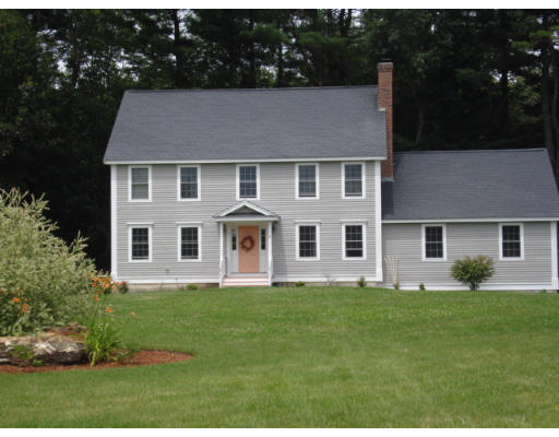 2 Pinewood Road Chelmsford, MA 01824 - Photo 1 of 1 a front view of a house with a yard and trees