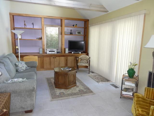 258 Huckins Neck Road Centerville, MA 02601 - Photo 14 of 30 a living room with furniture a window and a flat screen tv