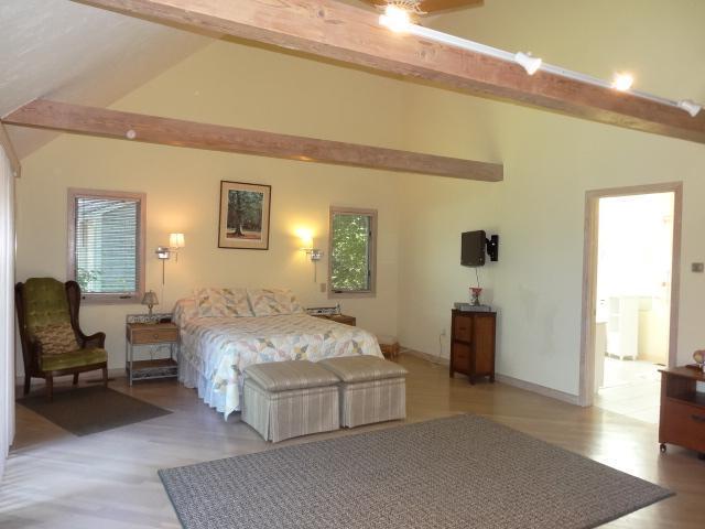 258 Huckins Neck Road Centerville, MA 02601 - Photo 15 of 30 a spacious bedroom with a bed and window