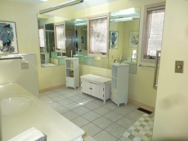 258 Huckins Neck Road Centerville, MA 02601 - Photo 17 of 30 a bathroom with a sink a toilet and shower