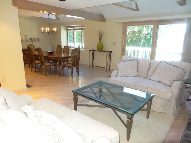 258 Huckins Neck Road Centerville, MA 02601 - Photo 18 of 30 a living room with furniture and a large window