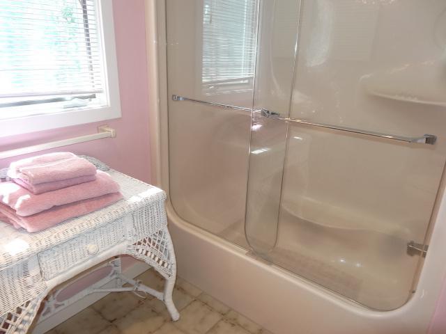 258 Huckins Neck Road Centerville, MA 02601 - Photo 23 of 30 a bathroom with a bathtub and shower