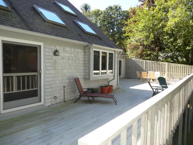258 Huckins Neck Road Centerville, MA 02601 - Photo 25 of 30 a backyard of a house with table and chairs