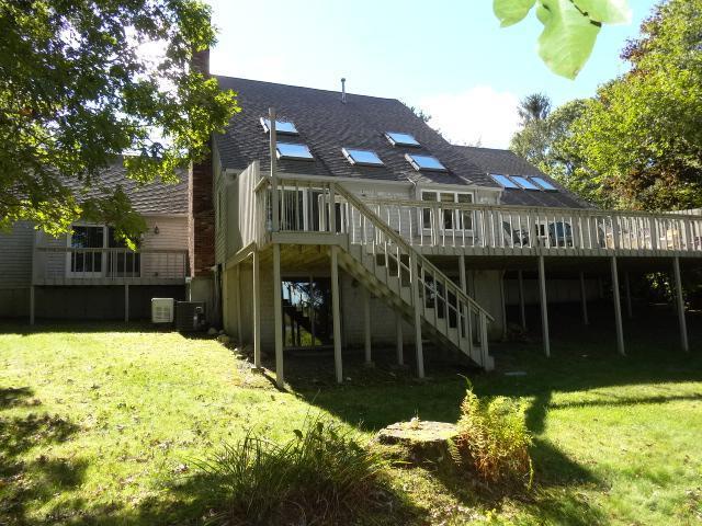 258 Huckins Neck Road Centerville, MA 02601 - Photo 28 of 30 a view of a house with a yard