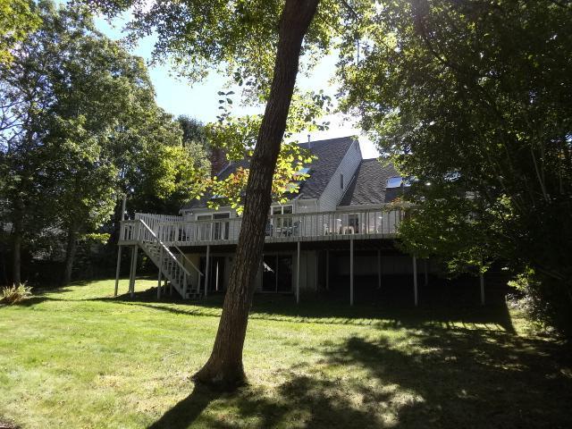 258 Huckins Neck Road Centerville, MA 02601 - Photo 4 of 30 a view of a house with a yard