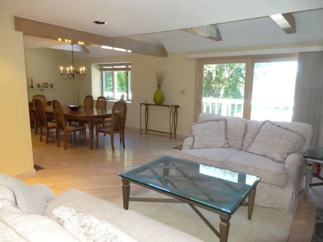 258 Huckins Neck Road Centerville, MA 02601 - Photo 7 of 30 a living room with furniture and a large window