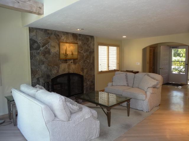 258 Huckins Neck Road Centerville, MA 02601 - Photo 8 of 30 a living room with furniture and a fireplace