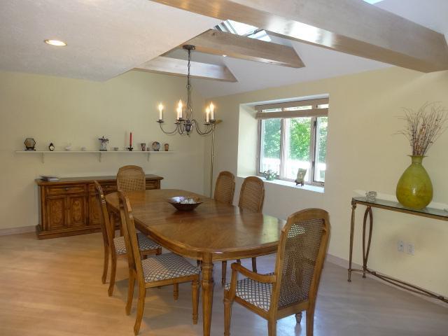 258 Huckins Neck Road Centerville, MA 02601 - Photo 9 of 30 a view of a dining room with furniture and chandelier
