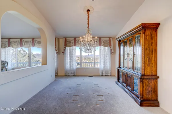 a view of a balcony with chairs