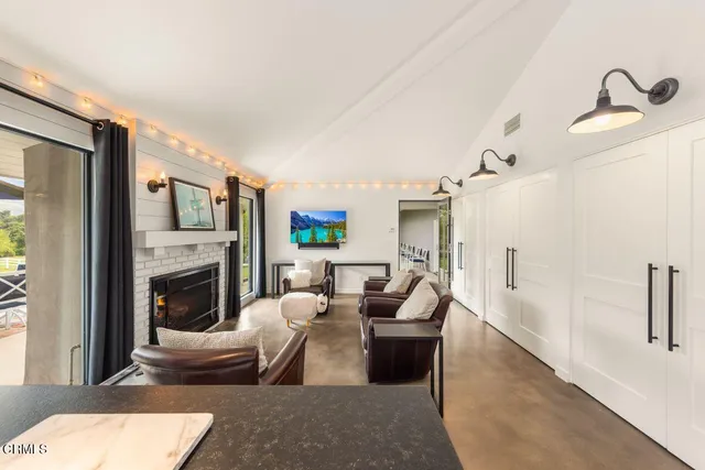 a dining room with furniture window and wooden floor