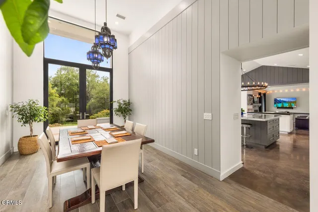 a view of a hallway view with wooden floor and furniture