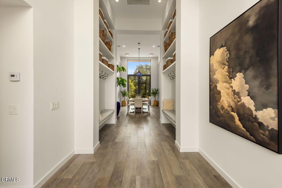 291 Saddle Lane Ojai, CA 93023 - Photo 15 of 47 a view of a hallway view with wooden floor and furniture