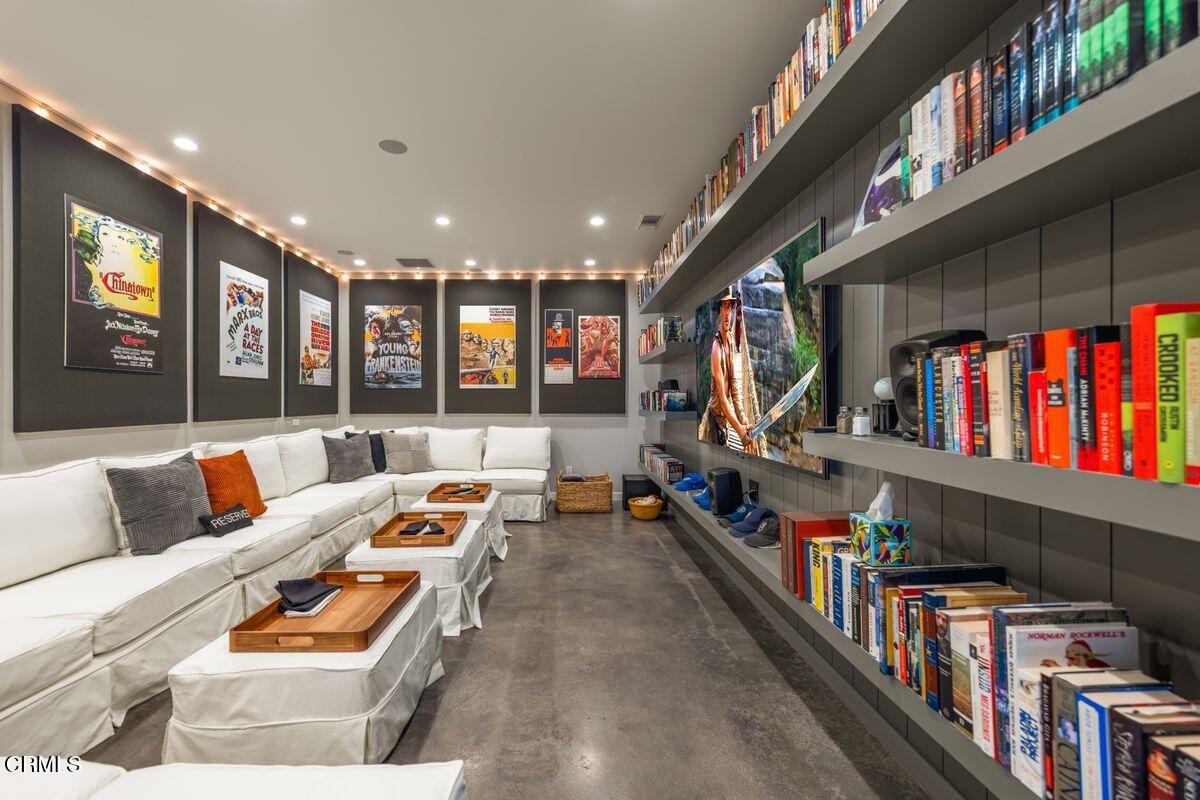 291 Saddle Lane Ojai, CA 93023 - Photo 16 of 47 a living room with furniture lots of furniture and a book shelf