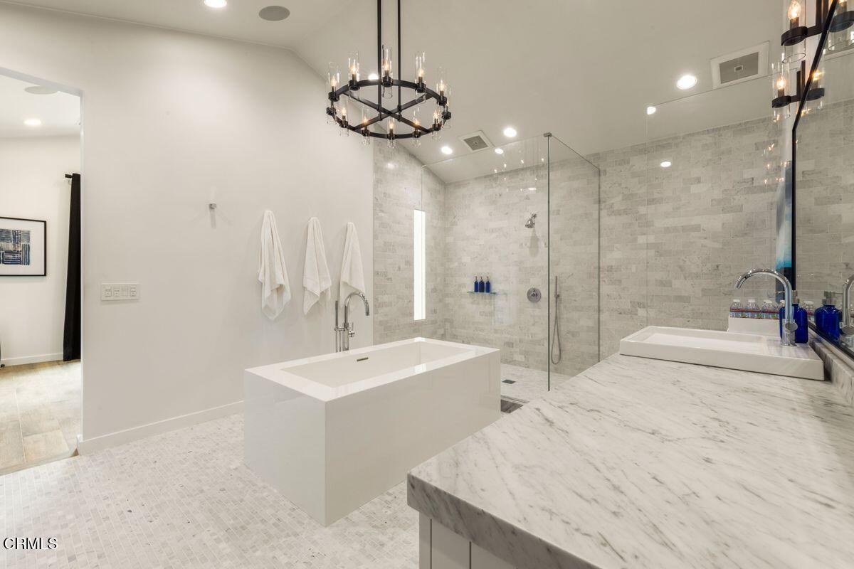 291 Saddle Lane Ojai, CA 93023 - Photo 19 of 47 a bathroom with a sink a light fixture and a glass door