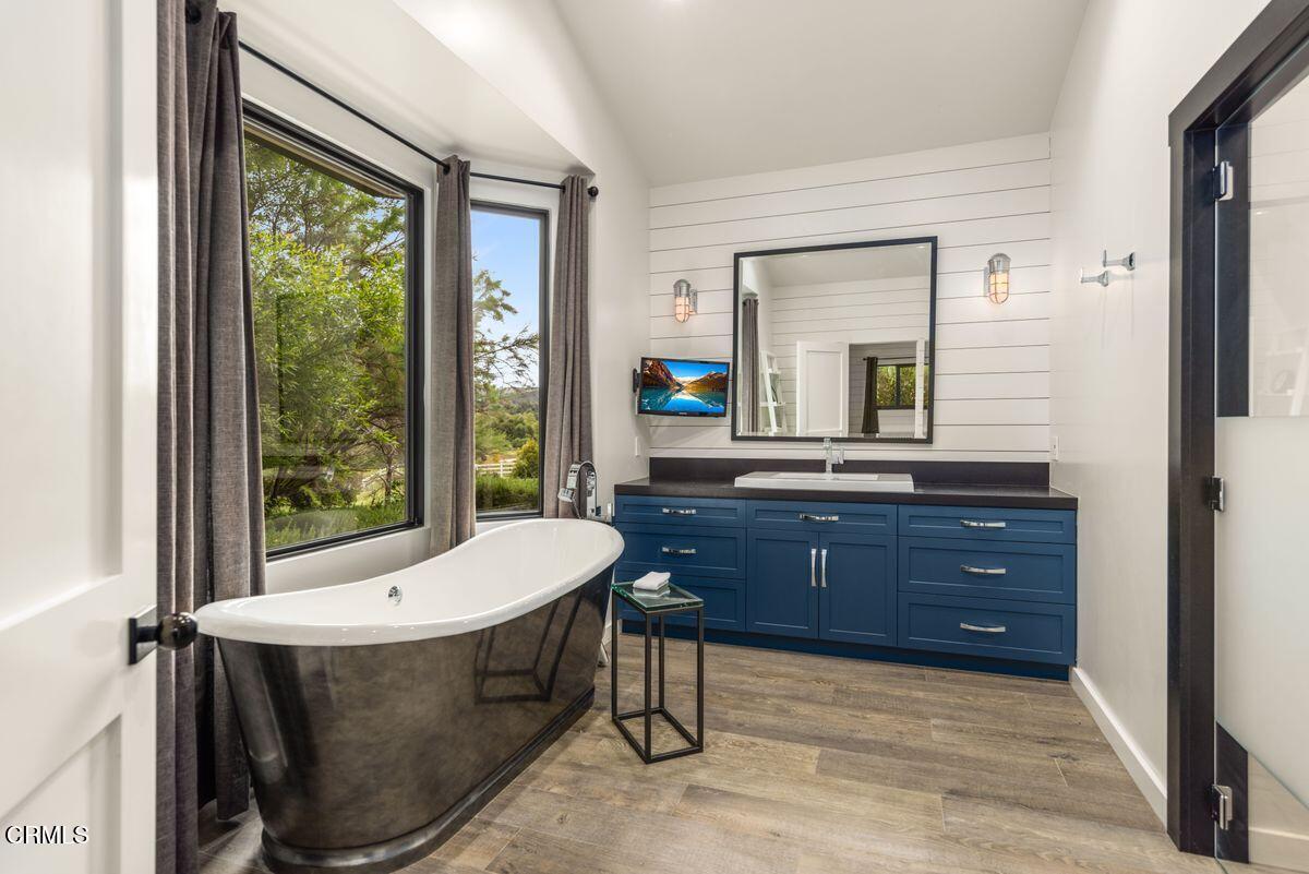291 Saddle Lane Ojai, CA 93023 - Photo 23 of 47 a bathroom with a granite countertop sink and a mirror
