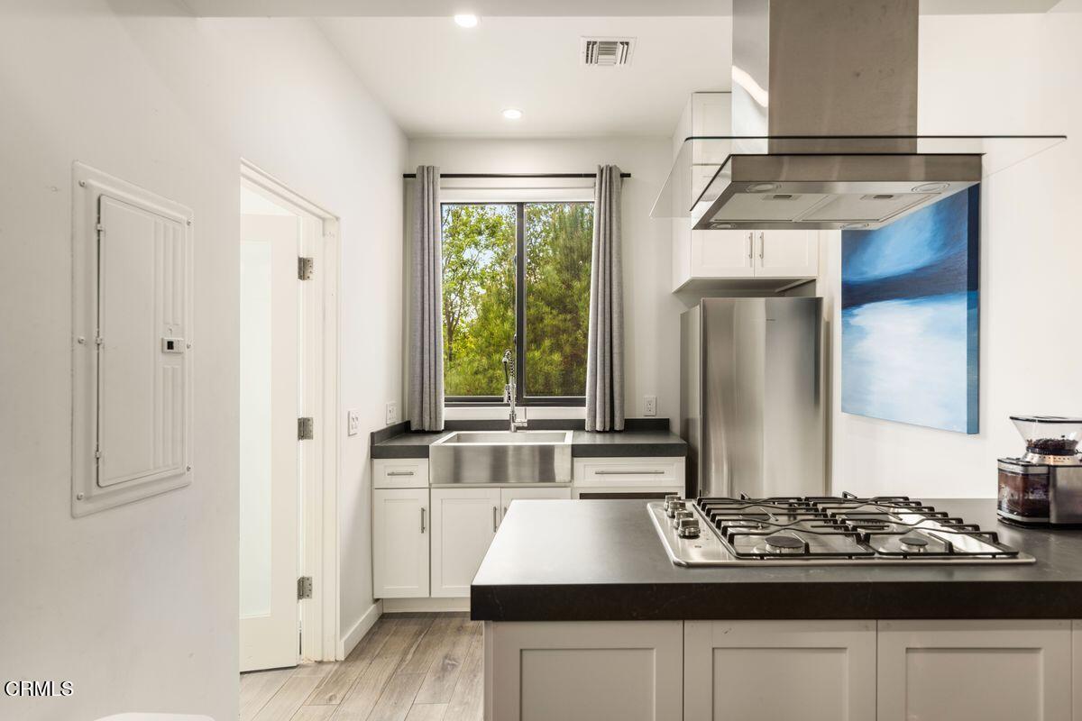 291 Saddle Lane Ojai, CA 93023 - Photo 33 of 47 a view of a kitchen with stainless steel appliances granite countertop a stove and a refrigerator