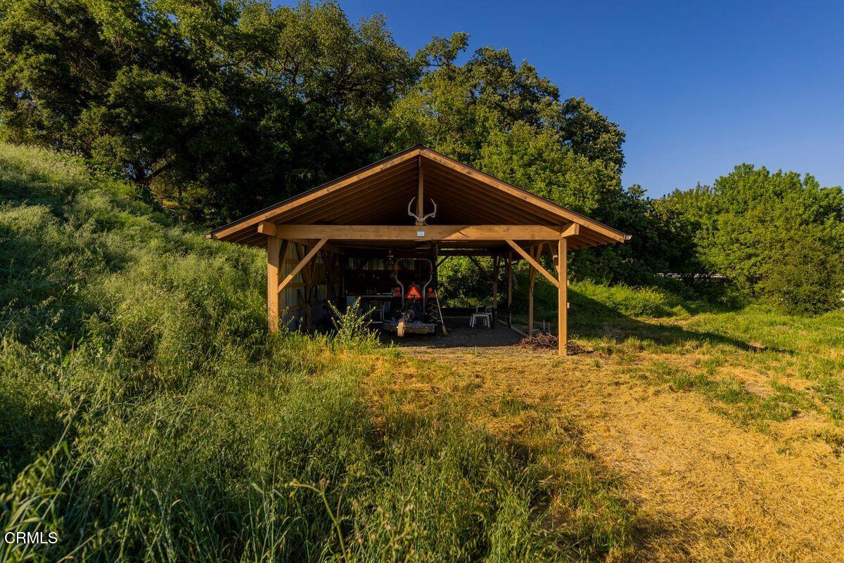 291 Saddle Lane Ojai, CA 93023 - Photo 44 of 47 a view of a wooden house with a yard