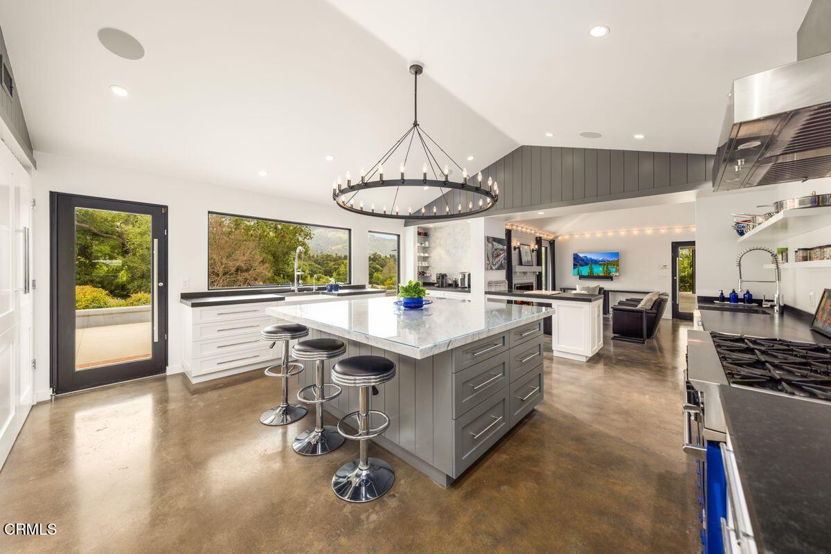 291 Saddle Lane Ojai, CA 93023 - Photo 6 of 47 a kitchen with stainless steel appliances granite countertop a stove and a refrigerator