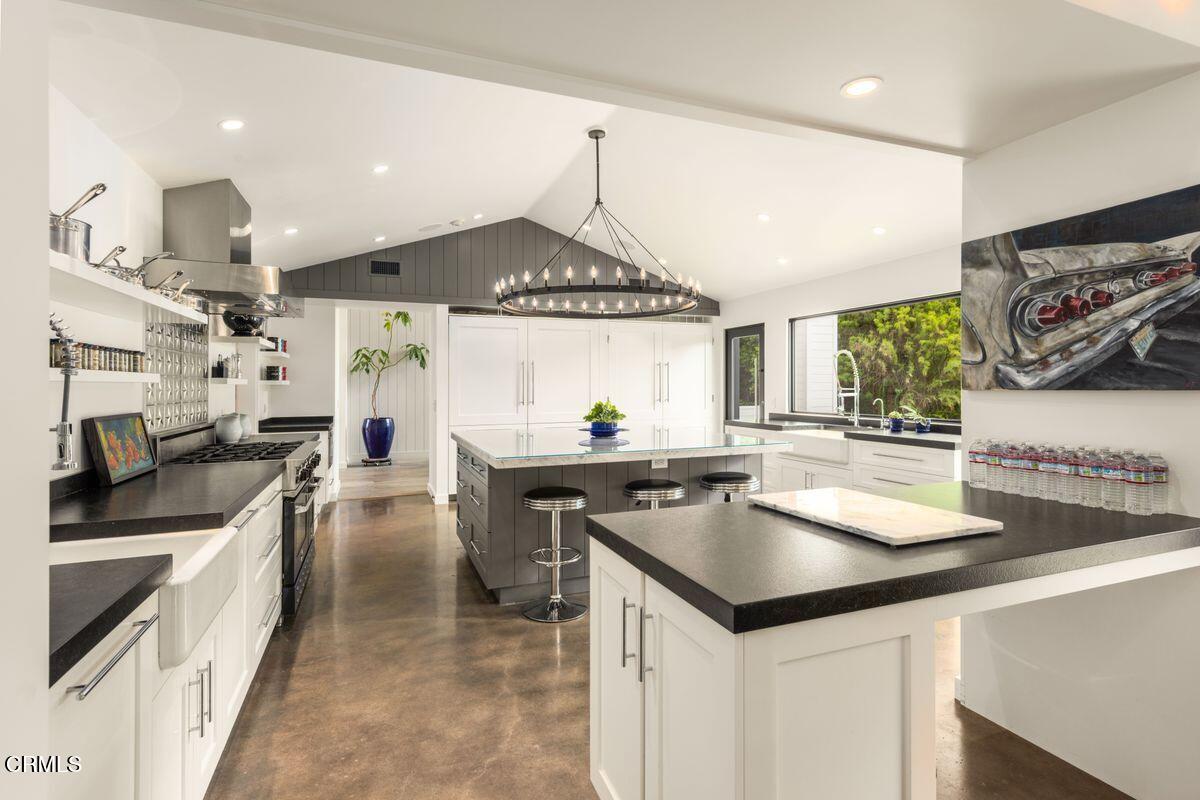 291 Saddle Lane Ojai, CA 93023 - Photo 9 of 47 a kitchen with stainless steel appliances a sink stove and cabinets