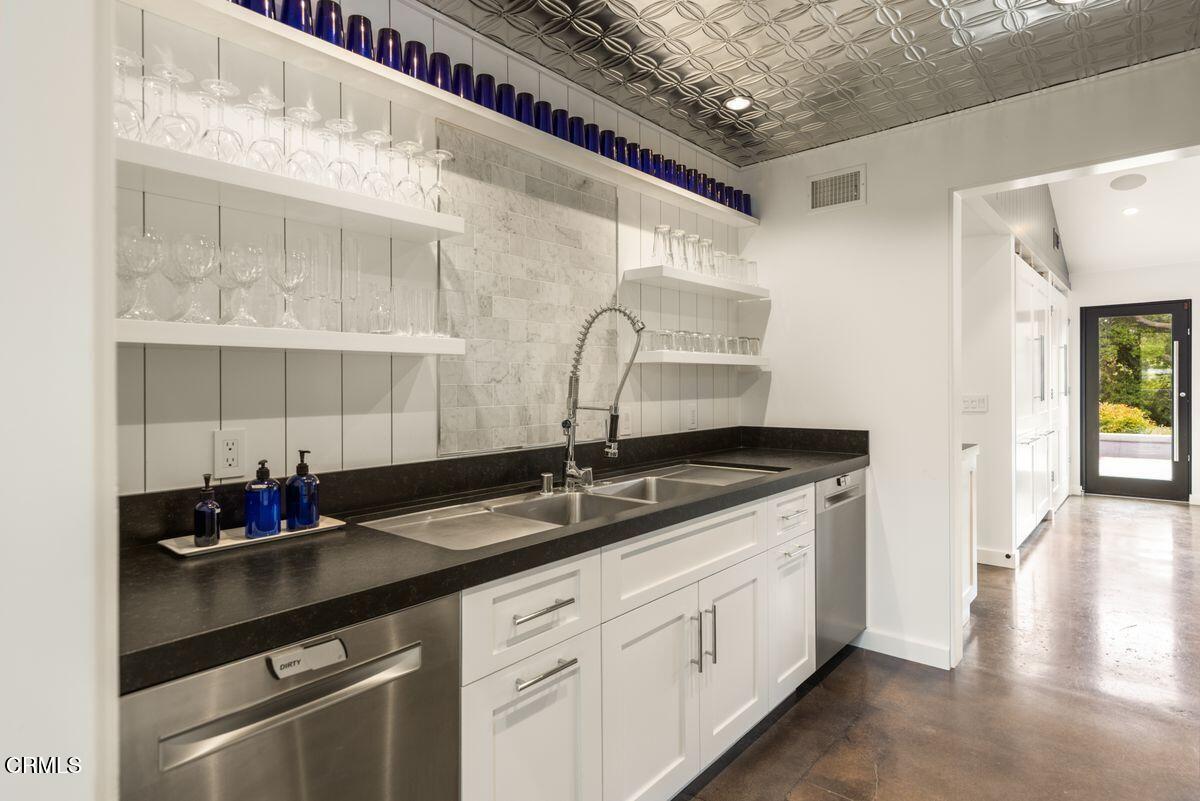 291 Saddle Lane Ojai, CA 93023 - Photo 10 of 47 a kitchen with a sink and cabinets