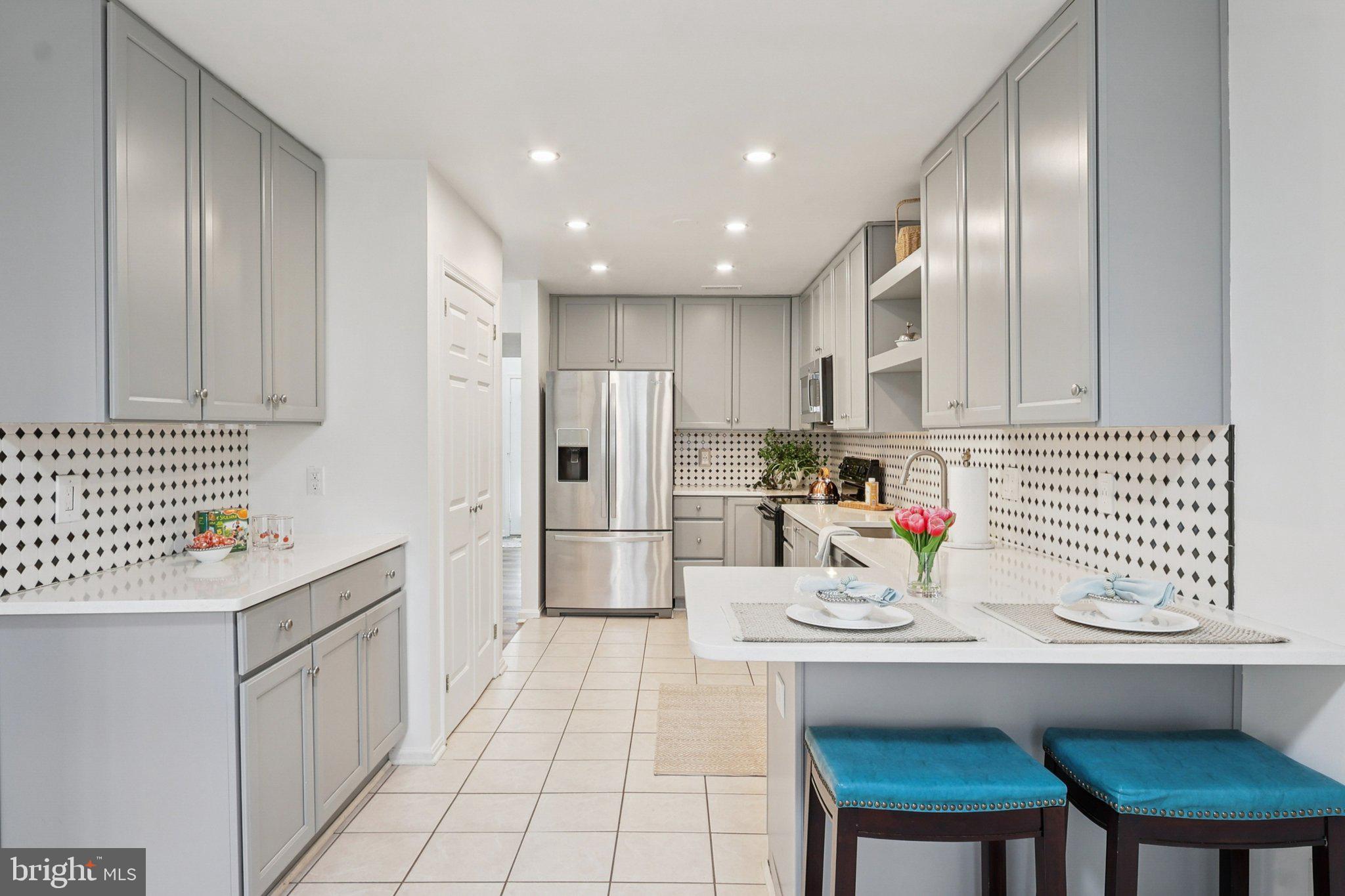 770 Bellefield Road, Unit 107 Solomons, MD 20629 - Photo 14 of 66 Cheerful kitchen and breakfast bar