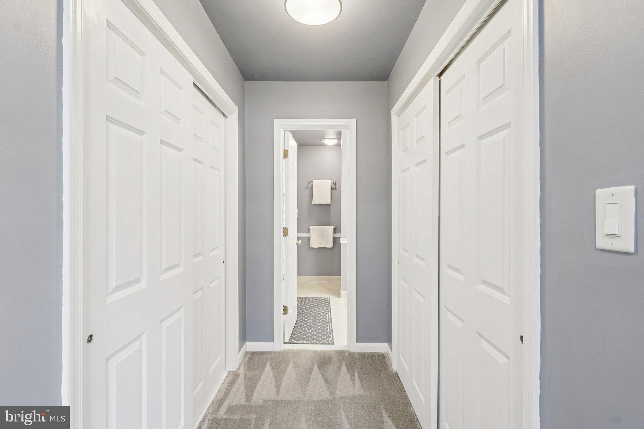 770 Bellefield Road, Unit 107 Solomons, MD 20629 - Photo 32 of 66 Hall to En Suite Bath with 2 of 4 closets
