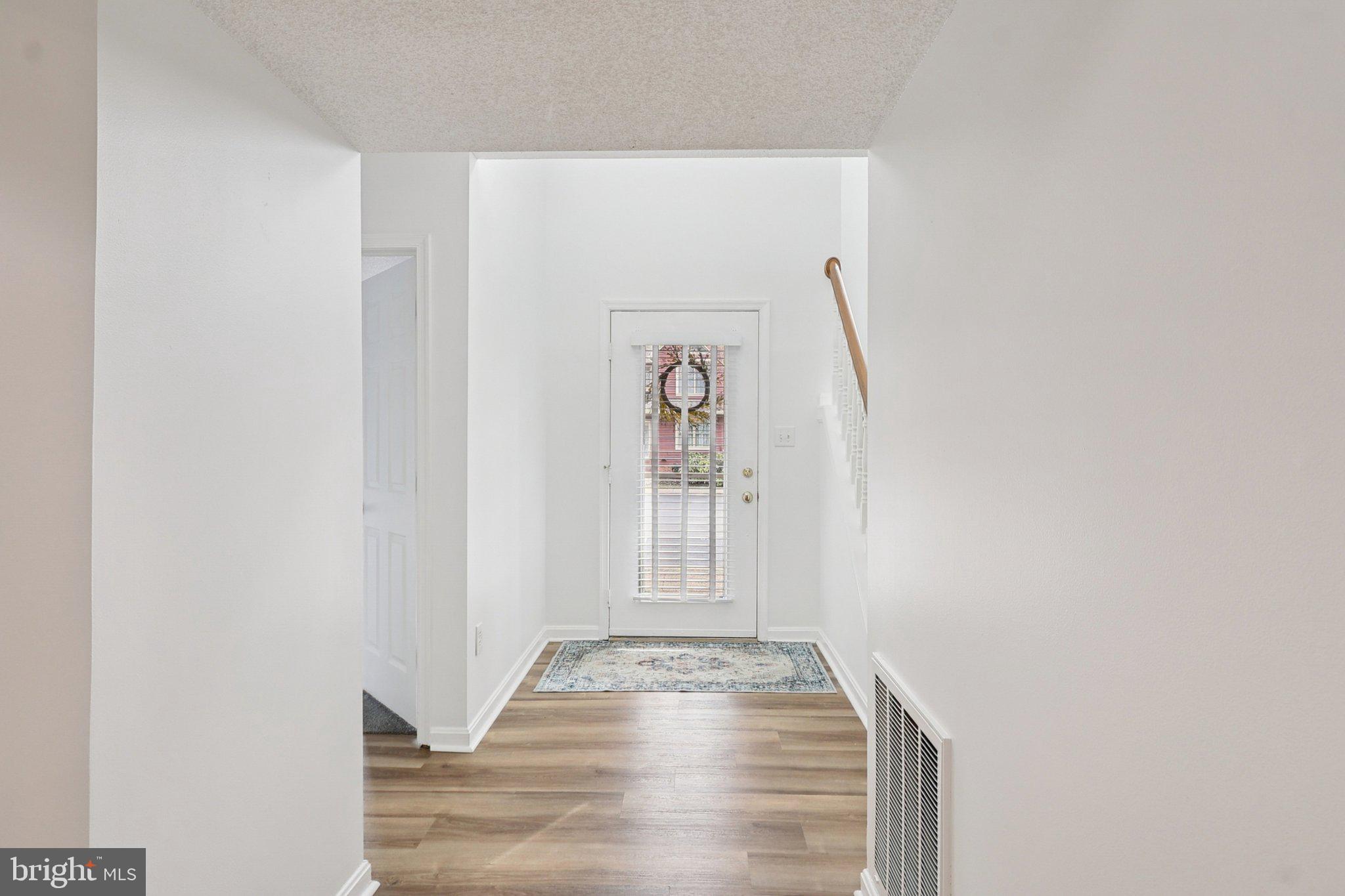 770 Bellefield Road, Unit 107 Solomons, MD 20629 - Photo 5 of 66 Foyer with LL Bedroom to the Left