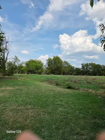 a view of an outdoor space and a yard
