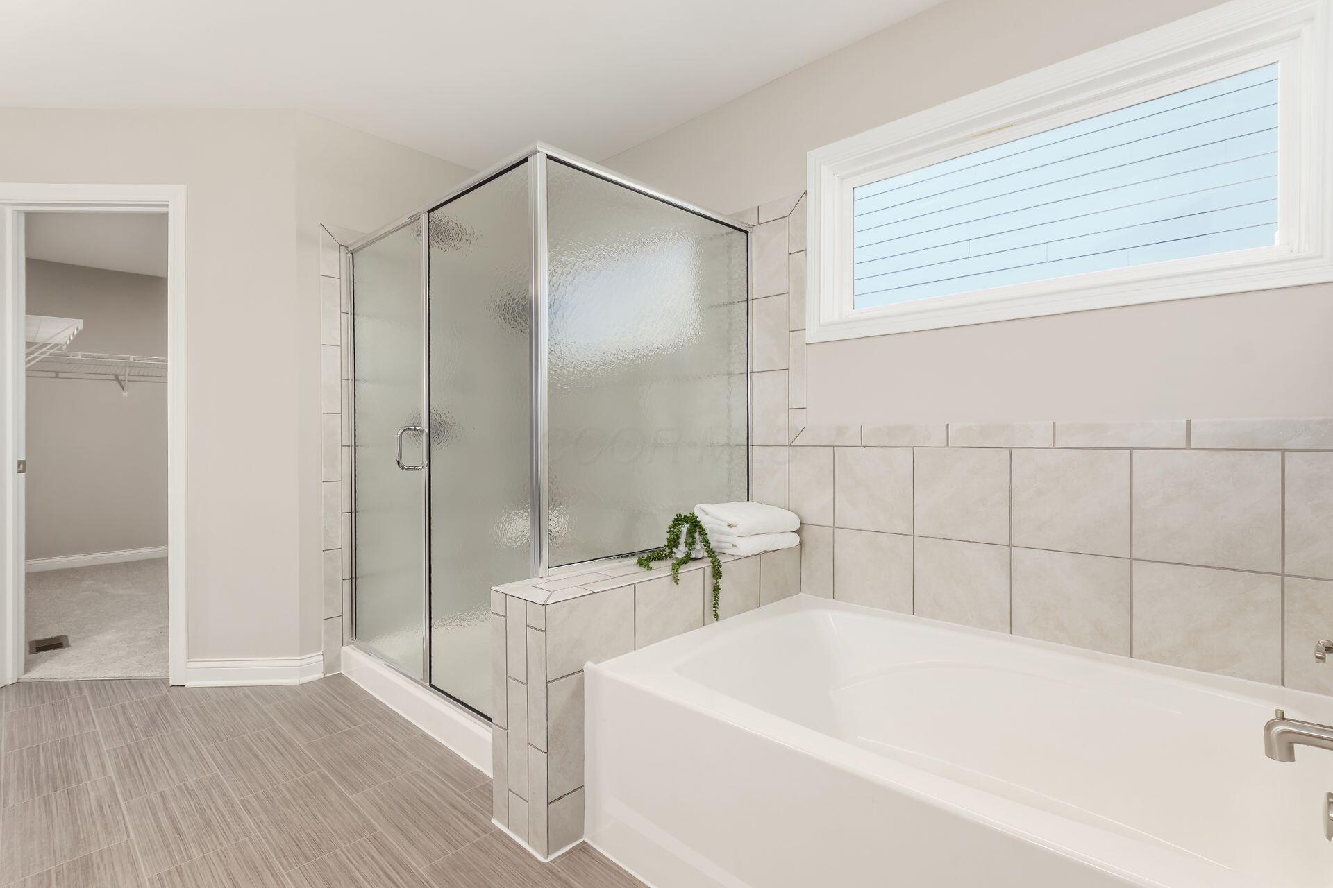 239 Harness Way Delaware, OH 43015 - Photo 27 of 45 Wash your cares away. Soak tub and large shower and natural light.