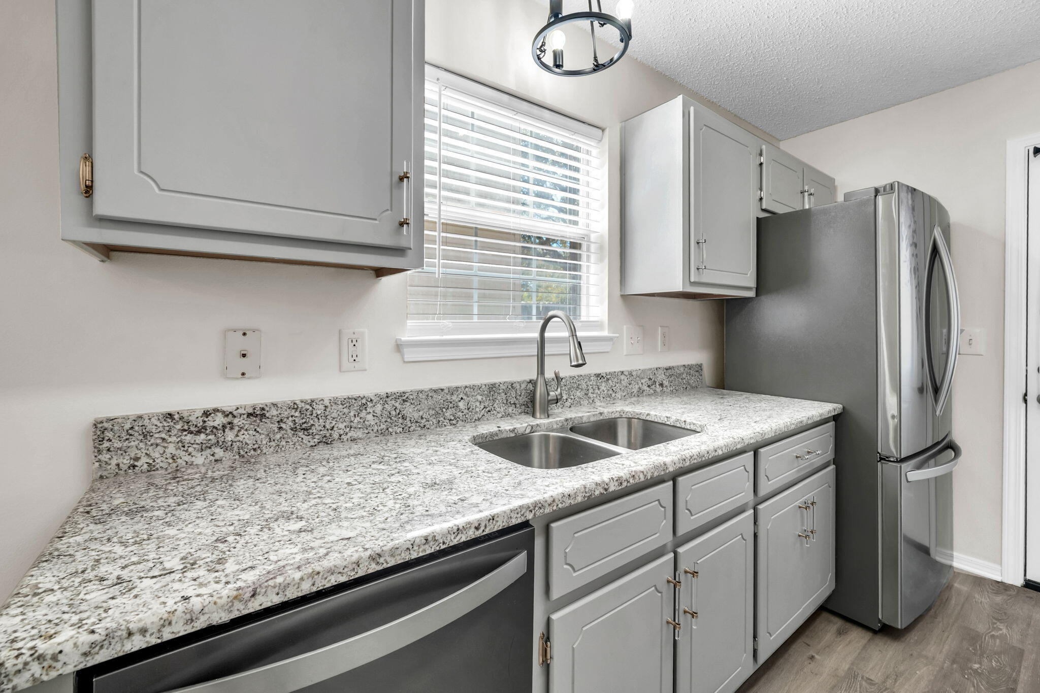 1036 Blue Ridge Drive Fort Walton Beach, FL 32547 - Photo 12 of 31 a kitchen with stainless steel appliances granite countertop a sink and refrigerator