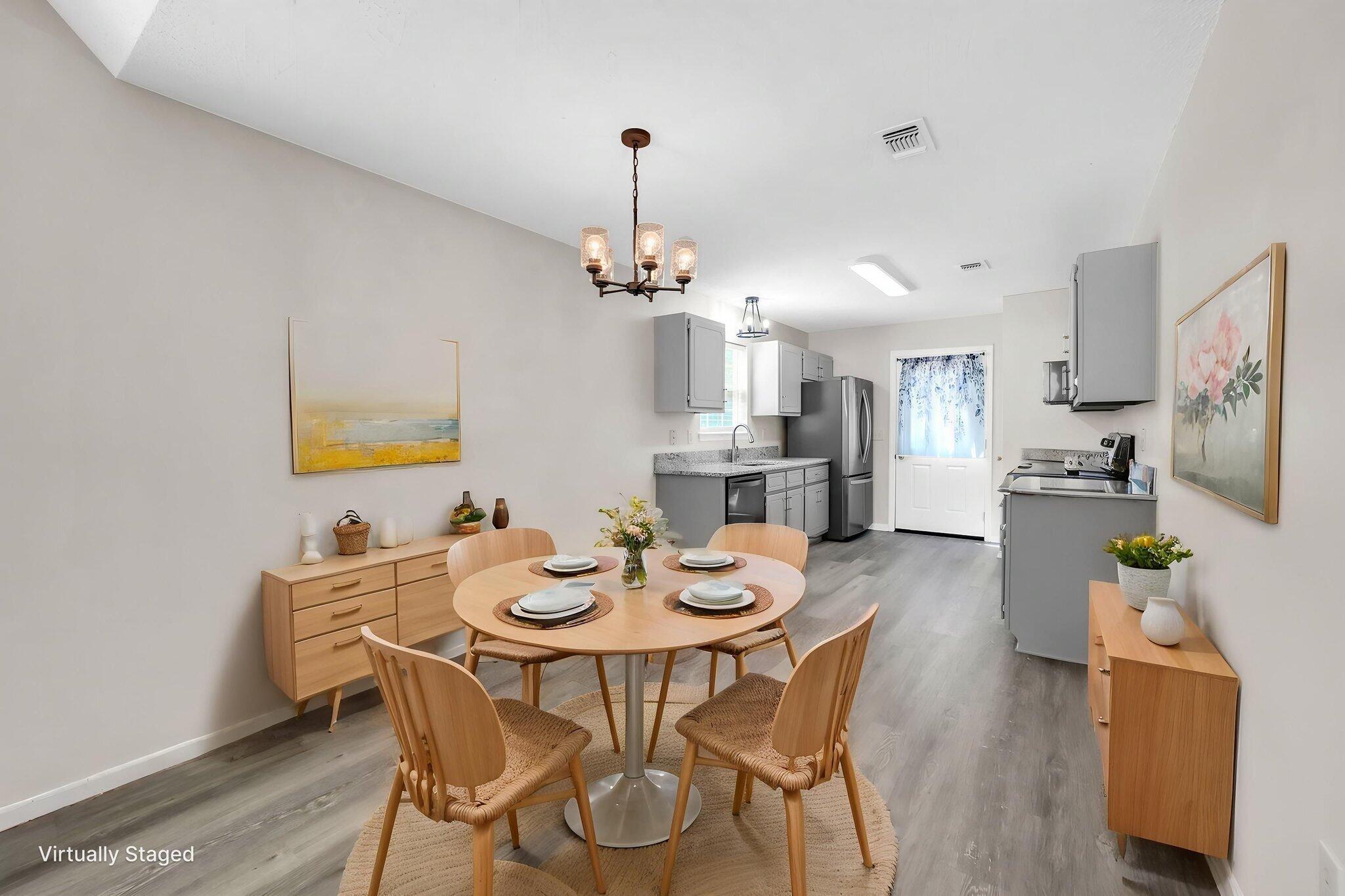 1036 Blue Ridge Drive Fort Walton Beach, FL 32547 - Photo 15 of 31 a view of a dining room with furniture and wooden floor