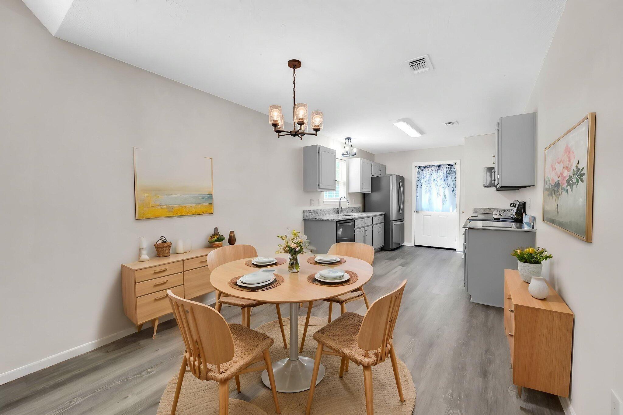1036 Blue Ridge Drive Fort Walton Beach, FL 32547 - Photo 16 of 31 a view of a dining room with furniture and wooden floor